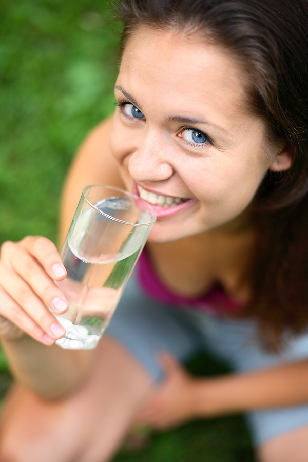 A woman choosing a healthy glass of water