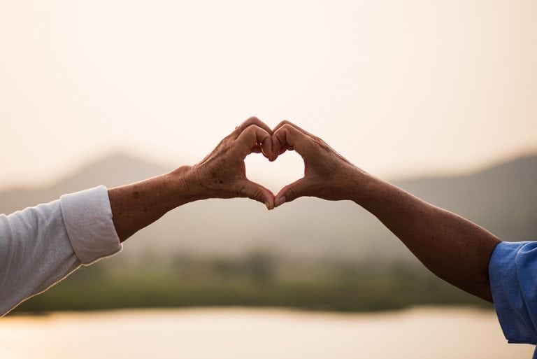 An older couple sharing warm, supportive connection