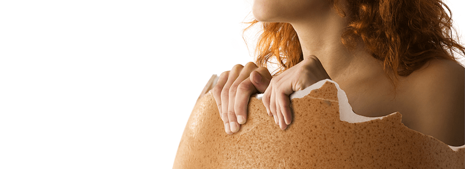 A woman emerging from a broken shell