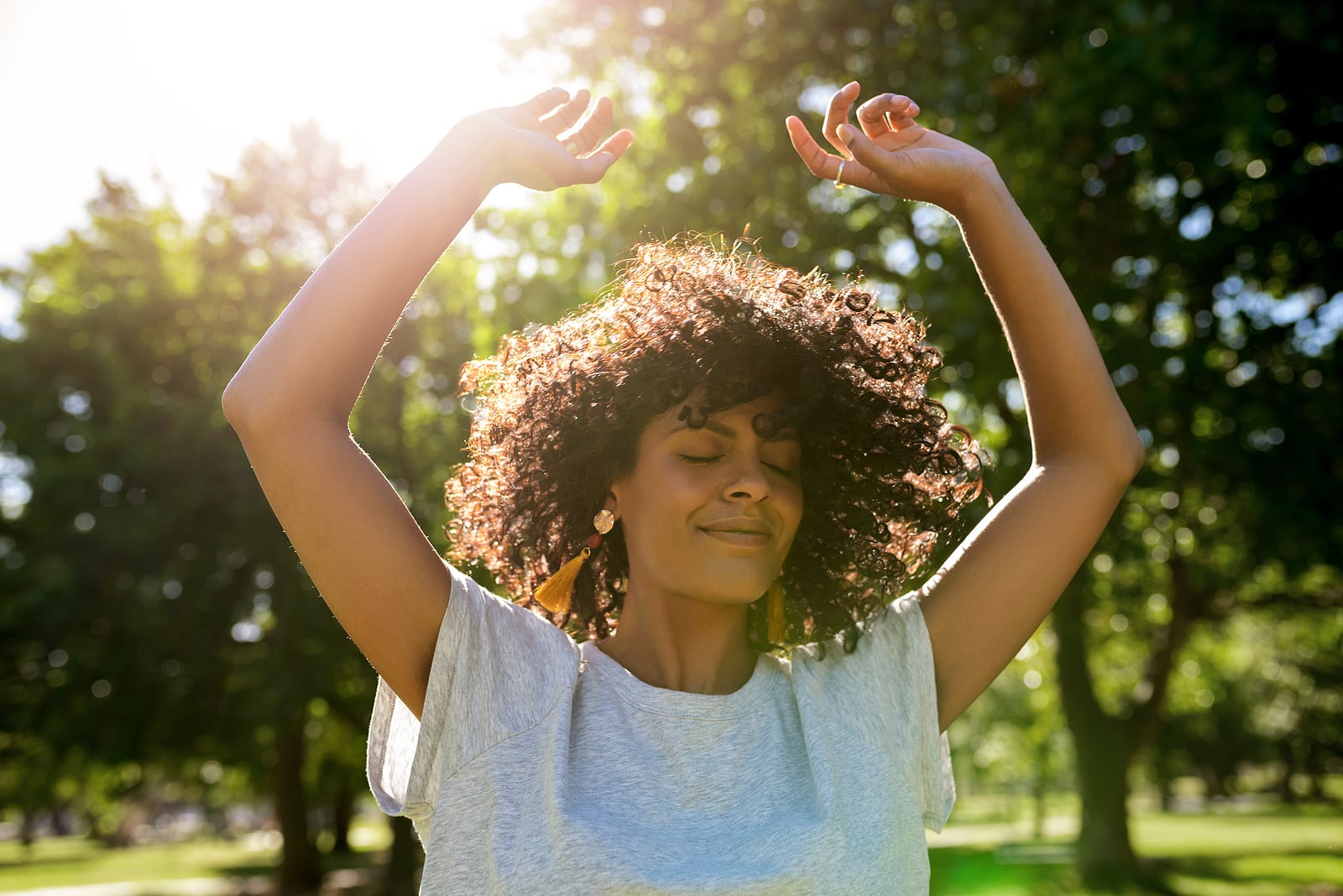 A woman moving freely in a park
